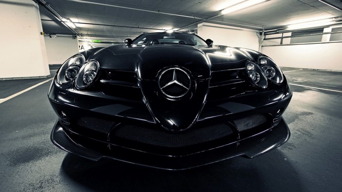 Black Mercedes-Benz SLR McLaren parked in a garage