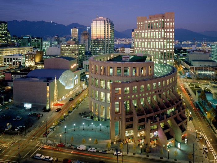Vancouver Public Library and cityscape at night