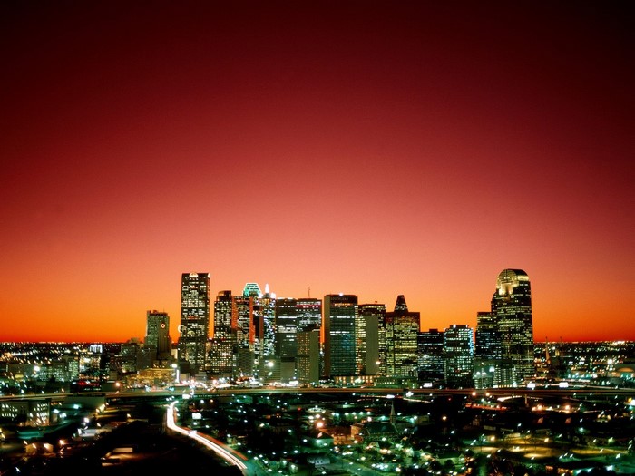 Dallas skyline at sunset with city lights