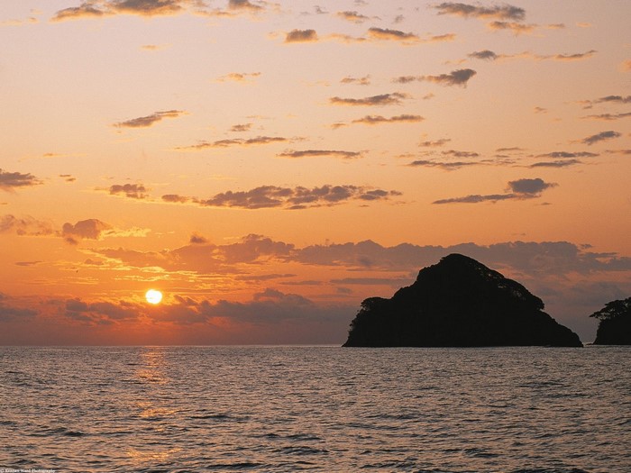 Sunset over the sea with islands