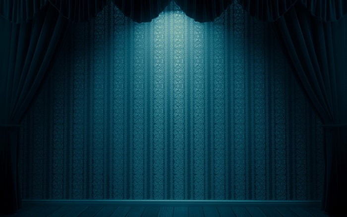 Blue patterned wallpaper with curtains and spotlight