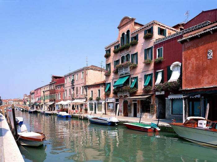 Venice canal with colorful buildings and boats
