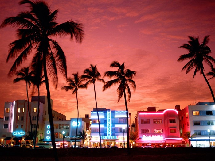 Miami Art Deco hotels at sunset with palm trees