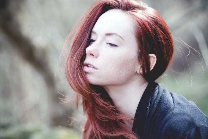 Redhead woman with freckles in a portrait