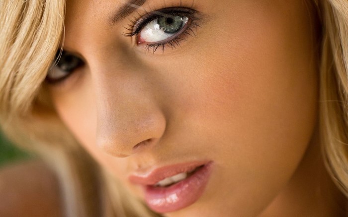 Close-up Portrait of a Blonde Woman with Blue Eyes