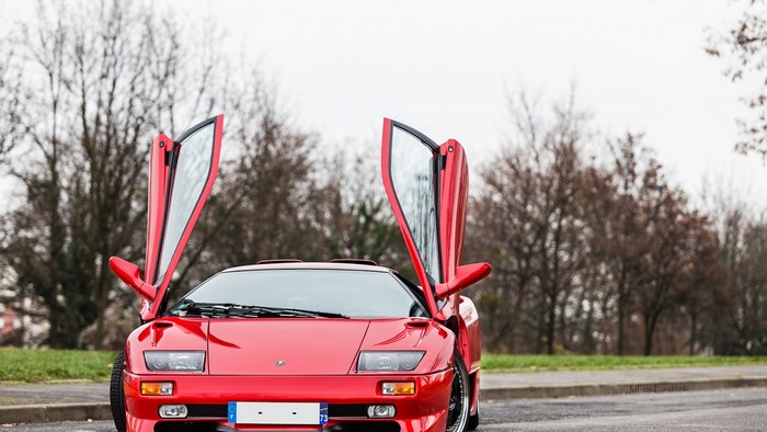 Red Lamborghini Diablo SV with doors open