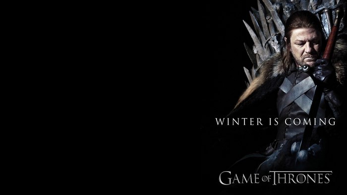 Ned Stark from Game of Thrones sitting on the Iron Throne