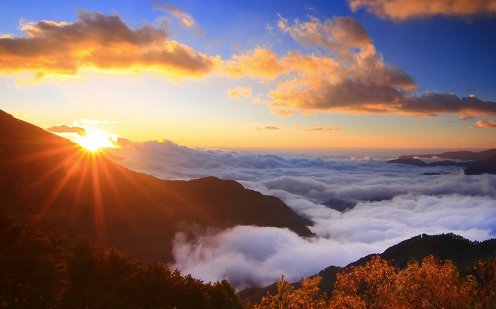 Sunrise over a sea of clouds in the mountains