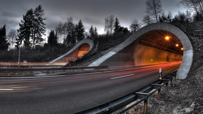 Road tunnels with light trails at night