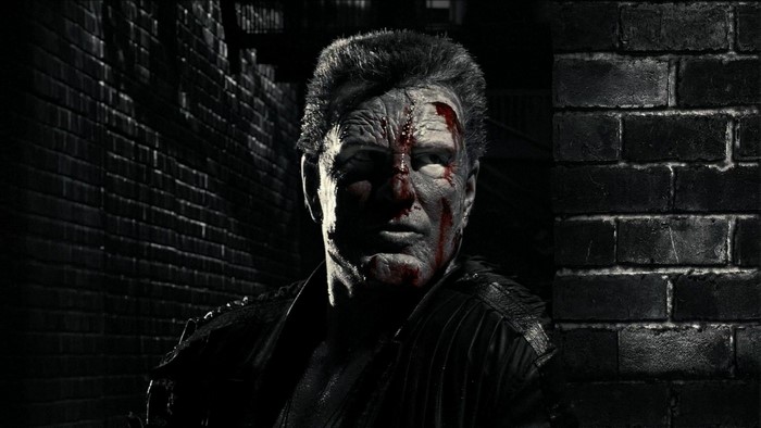 Marv from Sin City in a dark alley