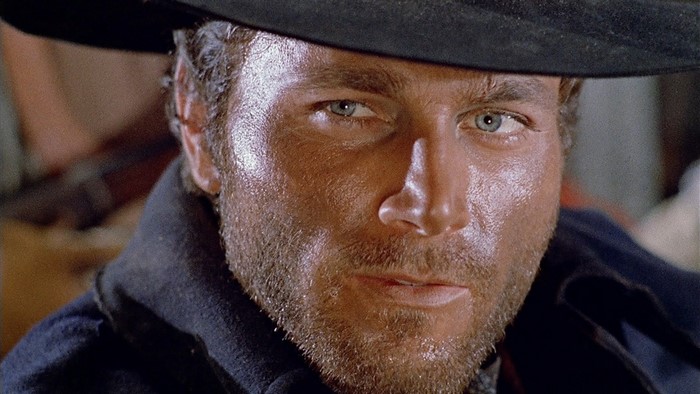 Man in hat with gray eyes and facial hair
