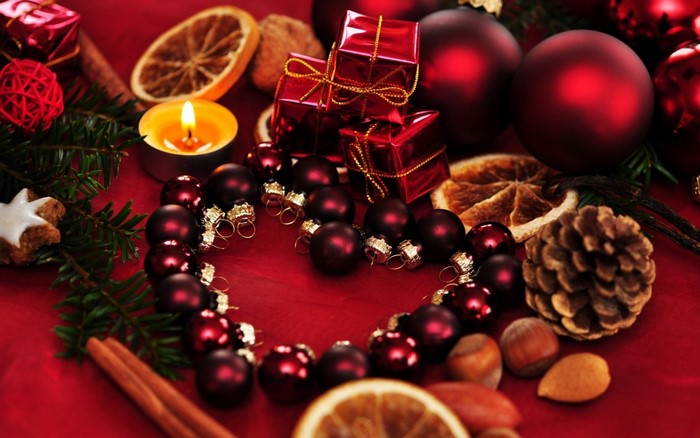 Festive Red Christmas Decorations and Candlelight