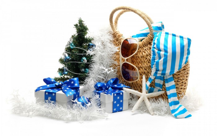 Christmas gifts and beach bag with sunglasses
