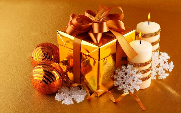 Golden Christmas Gift with Ornaments and Candles