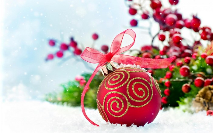 Red Christmas Ornament with Ribbon in Snow