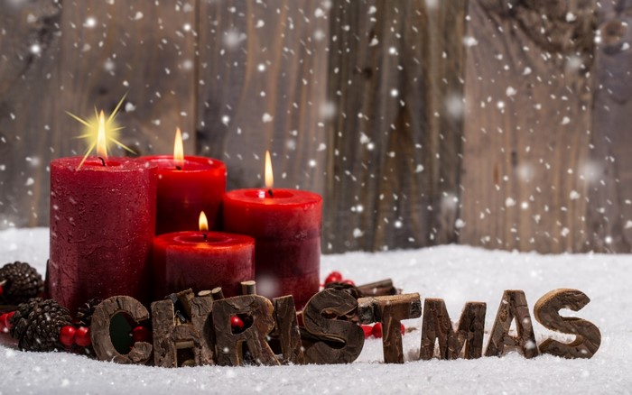 Cozy Red Christmas Candles in Snowy Winter Scene