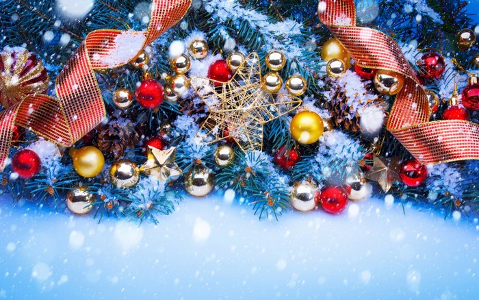 Christmas tree branches with ornaments and ribbon