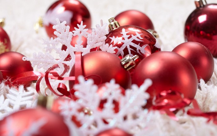 Red Christmas ornaments with snowflakes and ribbon