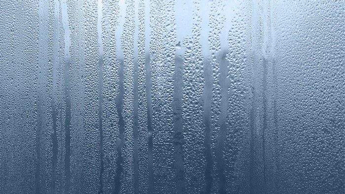 Blue condensation pattern on glass