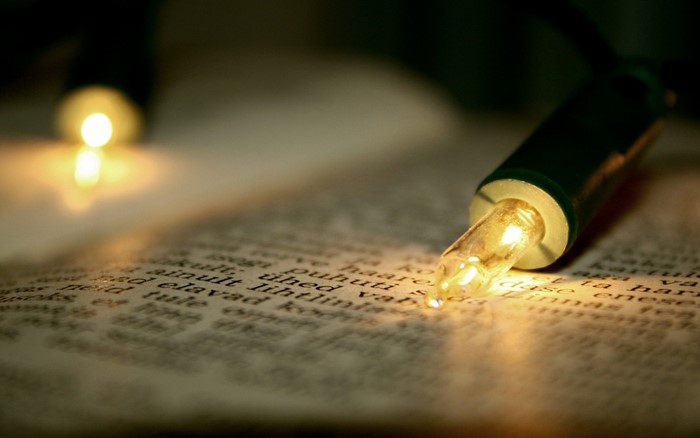 Close-up of Christmas lights on a book