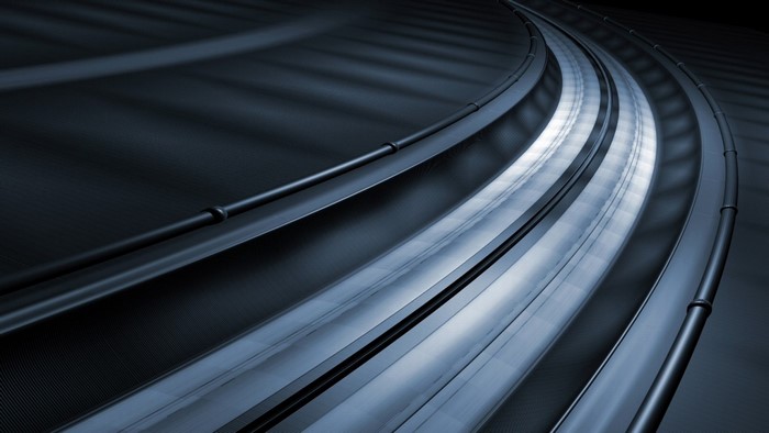 Abstract curved metallic structure with light reflections