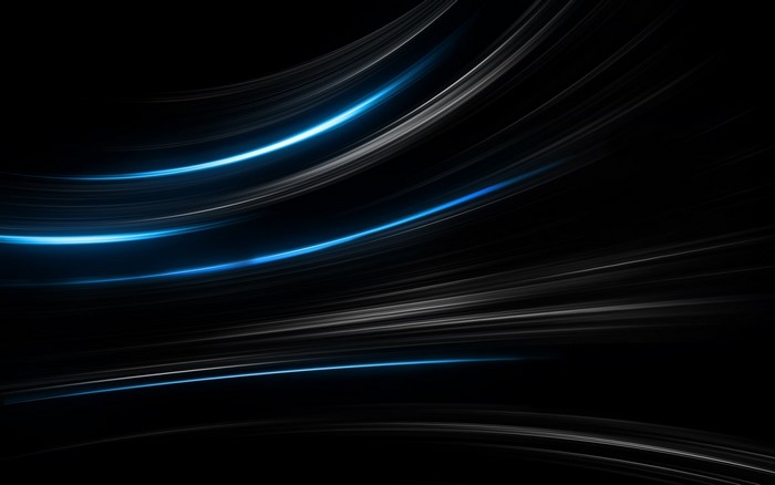 Abstract blue and white light streaks on black background
