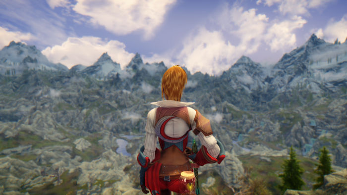 Woman overlooking a vast mountain range in Skyrim