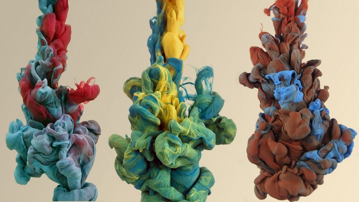 Ink in water: red, blue, yellow, and brown abstract forms