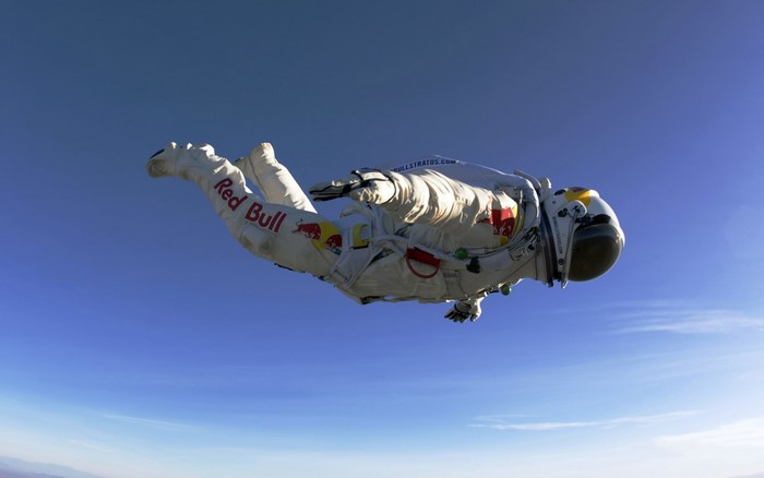 Felix Baumgartner in Red Bull Stratos suit skydiving