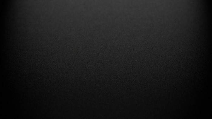 Black and white textured surface with vignette effect