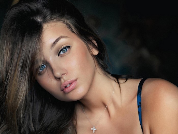 Portrait of a Woman with Blue Eyes and Long Hair