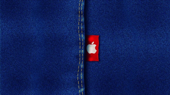 Apple logo on red tag on blue denim jeans