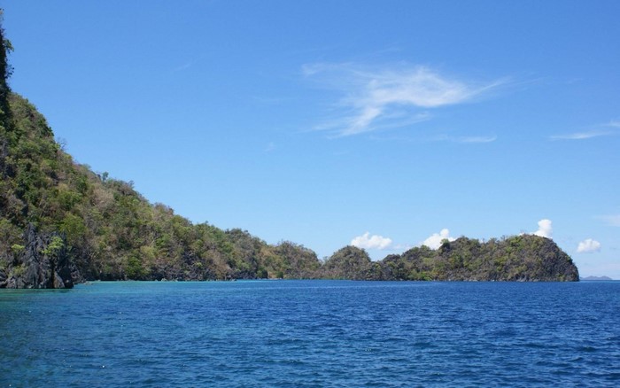 Islands and ocean under a blue sky