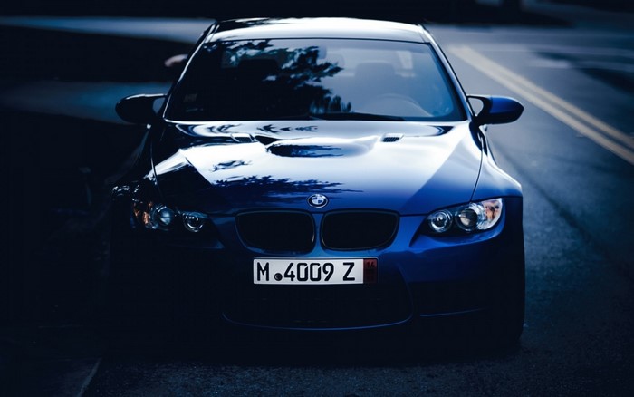 Blue BMW M4009Z Coupe on Road