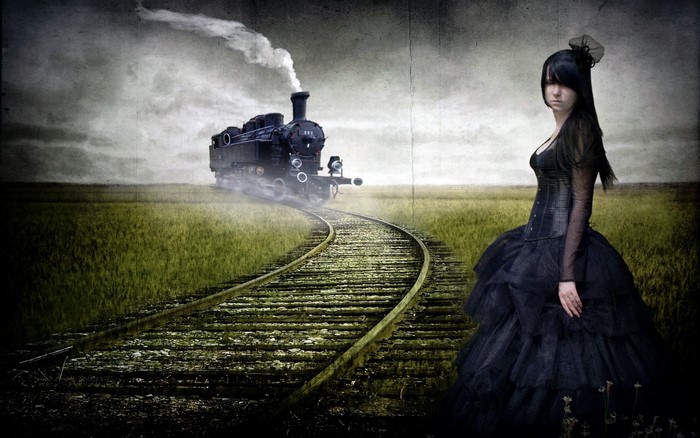 Gothic woman and steam locomotive on railway