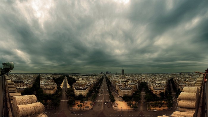Panoramic view of Paris with stormy clouds