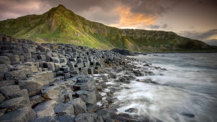 Giant's Causeway basalt columns and green hills