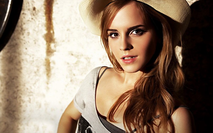 Emma Watson wearing a hat and a grey top