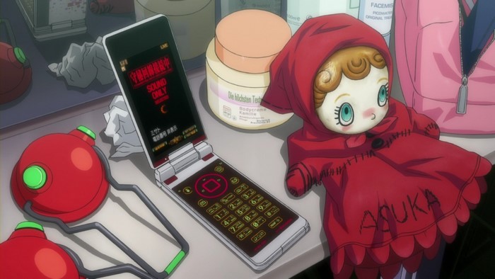 Misato's flip phone and Asuka doll from Neon Genesis Evangelion