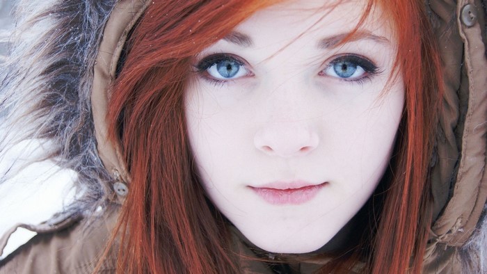 Close-up Portrait of Redhead Woman with Blue Eyes