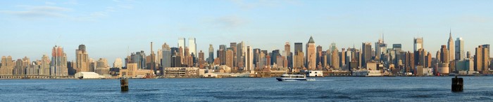 New York City skyline panorama with a boat on the water