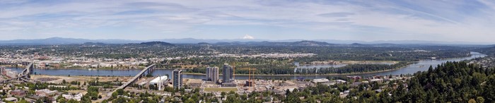 Panoramic cityscape of Portland, Oregon with Mount Hood in the distance