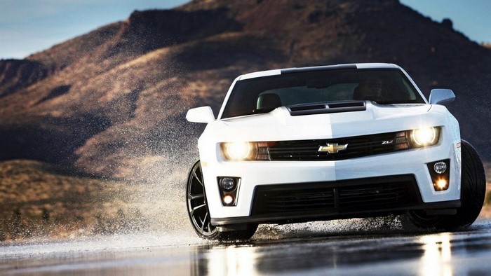White Chevrolet Camaro ZL1 driving through water