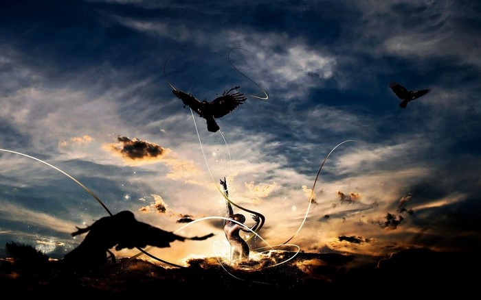 Silhouette figures and birds against a dramatic sunset sky