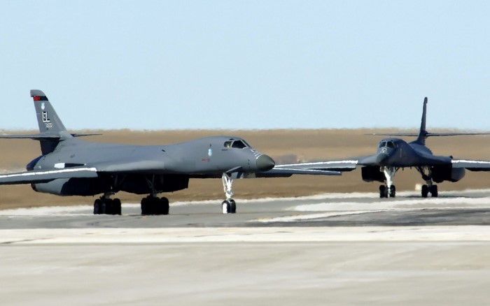 Two Rockwell B-1 Lancer bombers on a runway