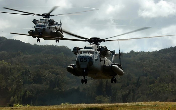 Two MH-53 Pave Low helicopters in flight