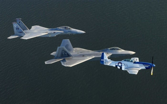 F-15 Eagle, F-22 Raptor, and P-51 Mustang formation flight