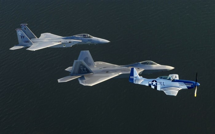 F-15 Eagle, F-22 Raptor, and P-51 Mustang formation flight
