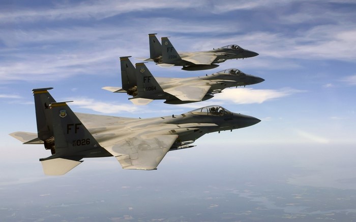 Three McDonnell Douglas F-15 Eagle fighter jets in formation