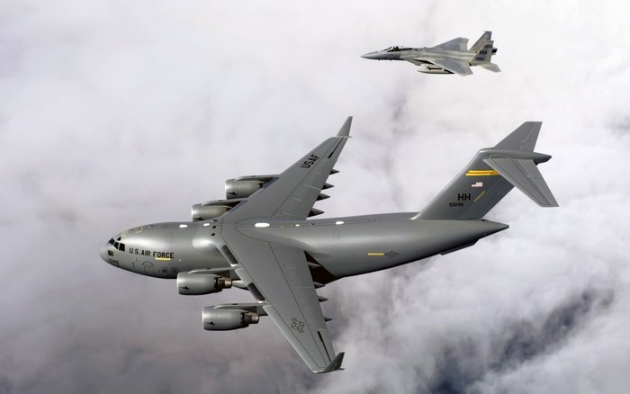 Boeing C-17 Globemaster III and F-15 Eagle in the sky